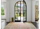 Grand entrance with arched glass doors and a view of the front yard at 1640 Kenai Rd, Kennesaw, GA 30152