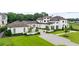Beautiful white stucco home with a lush green lawn and manicured landscaping at 1640 Kenai Rd, Kennesaw, GA 30152