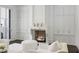 Inviting living room with fireplace, custom built-ins, and white furnishings at 1640 Kenai Rd, Kennesaw, GA 30152