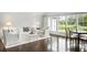 Elegant living room boasts hardwood floors and expansive windows with outdoor views at 1640 Kenai Rd, Kennesaw, GA 30152