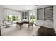 Bright home office with built-in shelves, a desk, and large windows at 1640 Kenai Rd, Kennesaw, GA 30152
