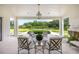 Inviting outdoor patio with seating and a view of the pool and landscaped backyard at 1640 Kenai Rd, Kennesaw, GA 30152