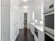 Well-organized white pantry with ample storage and modern appliances at 1640 Kenai Rd, Kennesaw, GA 30152
