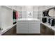 Spacious walk-in closet with custom shelving, drawers, and ample storage space at 1640 Kenai Rd, Kennesaw, GA 30152
