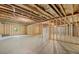 Unfinished basement with exposed beams, concrete floor, and framed walls ready to be customized for your needs at 51 Black Rock Rdg, Sharpsburg, GA 30277