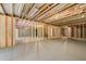 Unfinished basement with concrete floors and exposed ceiling and framing at 51 Black Rock Rdg, Sharpsburg, GA 30277