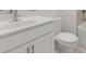 Bathroom features a white vanity, toilet, and tub with shower, and a large mirror and lighting at 51 Black Rock Rdg, Sharpsburg, GA 30277