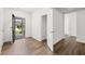 Inviting entryway with hardwood floors, closet space, and open doorway to porch at 51 Black Rock Rdg, Sharpsburg, GA 30277
