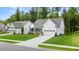 Beautiful home showcasing lush green grass, a long driveway, and an attached two-car garage at 51 Black Rock Rdg, Sharpsburg, GA 30277