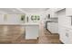 Modern kitchen featuring white cabinets, stainless steel appliances, and a center island with a white countertop at 51 Black Rock Rdg, Sharpsburg, GA 30277