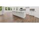 Bright, open kitchen featuring white cabinets, stainless steel appliances, and a large island at 51 Black Rock Rdg, Sharpsburg, GA 30277