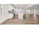 Bright, open-concept kitchen boasts white cabinets, stainless appliances, and seamlessly connects to the living area at 51 Black Rock Rdg, Sharpsburg, GA 30277