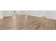 Spacious living room with hardwood flooring, bright lighting, and neutral paint at 51 Black Rock Rdg, Sharpsburg, GA 30277
