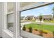 View from a window overlooking a suburban neighborhood with well-manicured lawns and similar single Gathering homes at 51 Black Rock Rdg, Sharpsburg, GA 30277