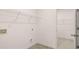 Bright laundry room with shelving and hookups for a washer and dryer at 575 Silver Moon Dr, Loganville, GA 30052