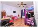 A playful ' room with bunk beds, hardwood floors, and a ceiling fan at 737 Wilkes Dr, Loganville, GA 30052
