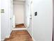 Bright entryway with hardwood floors and a staircase leading to the upper level, creating a welcoming first impression at 737 Wilkes Dr, Loganville, GA 30052