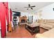 Cozy living room with a brick fireplace, mounted television, and comfortable leather sofa for relaxation and entertainment at 737 Wilkes Dr, Loganville, GA 30052
