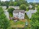 Expansive aerial view of home and backyard, featuring deck, patio, play area, and landscaping at 2508 Haddenham Sw Ln, Smyrna, GA 30082