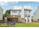 Beautiful home exterior with a deck, patio, and a well-maintained backyard play area at 2508 Haddenham Sw Ln, Smyrna, GA 30082