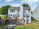 Charming home with a wooden deck, a spacious backyard, and patio seating area at 2508 Haddenham Sw Ln, Smyrna, GA 30082