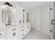 Renovated bathroom features double vanity, shower with glass door, and modern fixtures at 2508 Haddenham Sw Ln, Smyrna, GA 30082