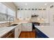 Bright kitchen featuring stainless steel appliances, white cabinetry, and quartz countertops at 2508 Haddenham Sw Ln, Smyrna, GA 30082