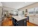 Open kitchen area with stainless steel appliances connects to the cozy living area at 2508 Haddenham Sw Ln, Smyrna, GA 30082