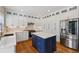 Modern kitchen boasts custom cabinets, stainless steel appliances, and center island at 2508 Haddenham Sw Ln, Smyrna, GA 30082