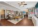 Expansive living room features hardwood floors, large sofa, and a flat screen TV for comfortable lounging at 2508 Haddenham Sw Ln, Smyrna, GA 30082