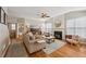 Inviting living room with fireplace, hardwood floors, and lots of natural light at 2508 Haddenham Sw Ln, Smyrna, GA 30082