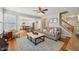 Open concept living room with hardwood floors seamlessly flows to dining area and kitchen at 2508 Haddenham Sw Ln, Smyrna, GA 30082