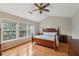 The primary bedroom features hardwood floors, vaulted ceilings, and multiple windows at 2508 Haddenham Sw Ln, Smyrna, GA 30082