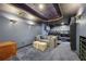Home theater features tiered seating, projector screen, and comfortable sectional sofa at 2508 Haddenham Sw Ln, Smyrna, GA 30082