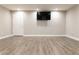 Finished basement with recessed lighting and wood-look flooring at 6695 Grove Meadows Ln, Cumming, GA 30028