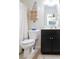 Compact bathroom with a shower, vanity, and toilet maximizes functionality in a limited space at 6695 Grove Meadows Ln, Cumming, GA 30028