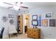Bedroom with natural light, ceiling fan, and neutral paint at 6695 Grove Meadows Ln, Cumming, GA 30028