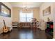 Bright, open room featuring hardwood floors, a chandelier, and ample storage at 6695 Grove Meadows Ln, Cumming, GA 30028