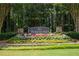 Community entrance sign for Parkstone surrounded by beautiful landscaping and greenery at 6695 Grove Meadows Ln, Cumming, GA 30028