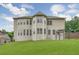 Well-maintained backyard with a lush lawn, creating a serene and private outdoor space at 1211 Fawndale Nw Dr, Kennesaw, GA 30152