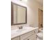 Bathroom featuring a white vanity with a decorative framed mirror and neutral wall paint at 1211 Fawndale Nw Dr, Kennesaw, GA 30152