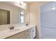Bright bathroom featuring double vanity, sleek white countertops, and undermount sinks at 1211 Fawndale Nw Dr, Kennesaw, GA 30152
