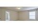 Bedroom with a window, neutral walls, carpet floors, and a walk-in closet for ample storage at 1211 Fawndale Nw Dr, Kennesaw, GA 30152