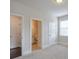 Bedroom with adjoining bathroom and large windows, allowing for lots of natural light at 1211 Fawndale Nw Dr, Kennesaw, GA 30152