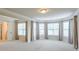 Large bedroom with neutral walls, carpet, crown molding and multiple windows at 1211 Fawndale Nw Dr, Kennesaw, GA 30152