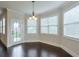 Dining area with dark hardwood floors, lots of natural light, and a view to the yard at 1211 Fawndale Nw Dr, Kennesaw, GA 30152