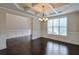 Elegant dining room showcasing coffered ceilings, wainscoting, and natural light from a large window at 1211 Fawndale Nw Dr, Kennesaw, GA 30152