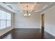Spacious dining room with dark hardwood floors, coffered ceiling, and decorative wainscoting at 1211 Fawndale Nw Dr, Kennesaw, GA 30152