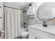 Bathroom featuring a tub and shower with a decorative vanity at 1261 Calhoun Sw Ter, Atlanta, GA 30314