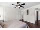Spacious bedroom featuring trim, hardwood floors, with a ceiling fan at 1261 Calhoun Sw Ter, Atlanta, GA 30314